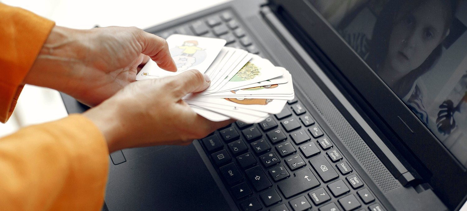 Online poker on a laptop in a warm home setting
